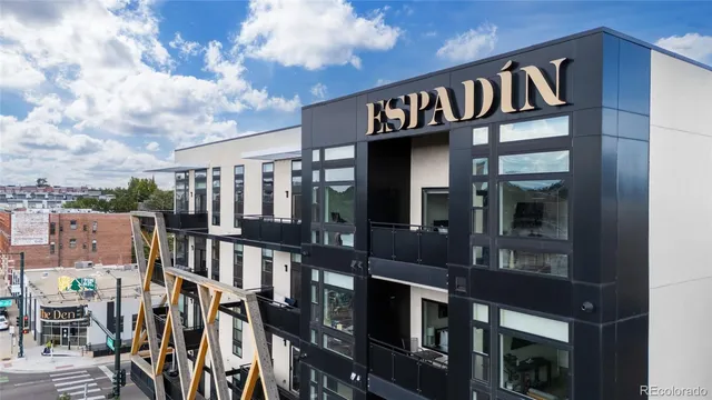 a front view of a building with glass door and windows