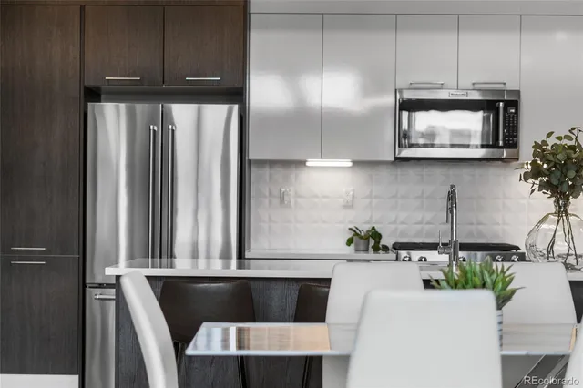 a kitchen with a cabinets a potted plant and a fireplace