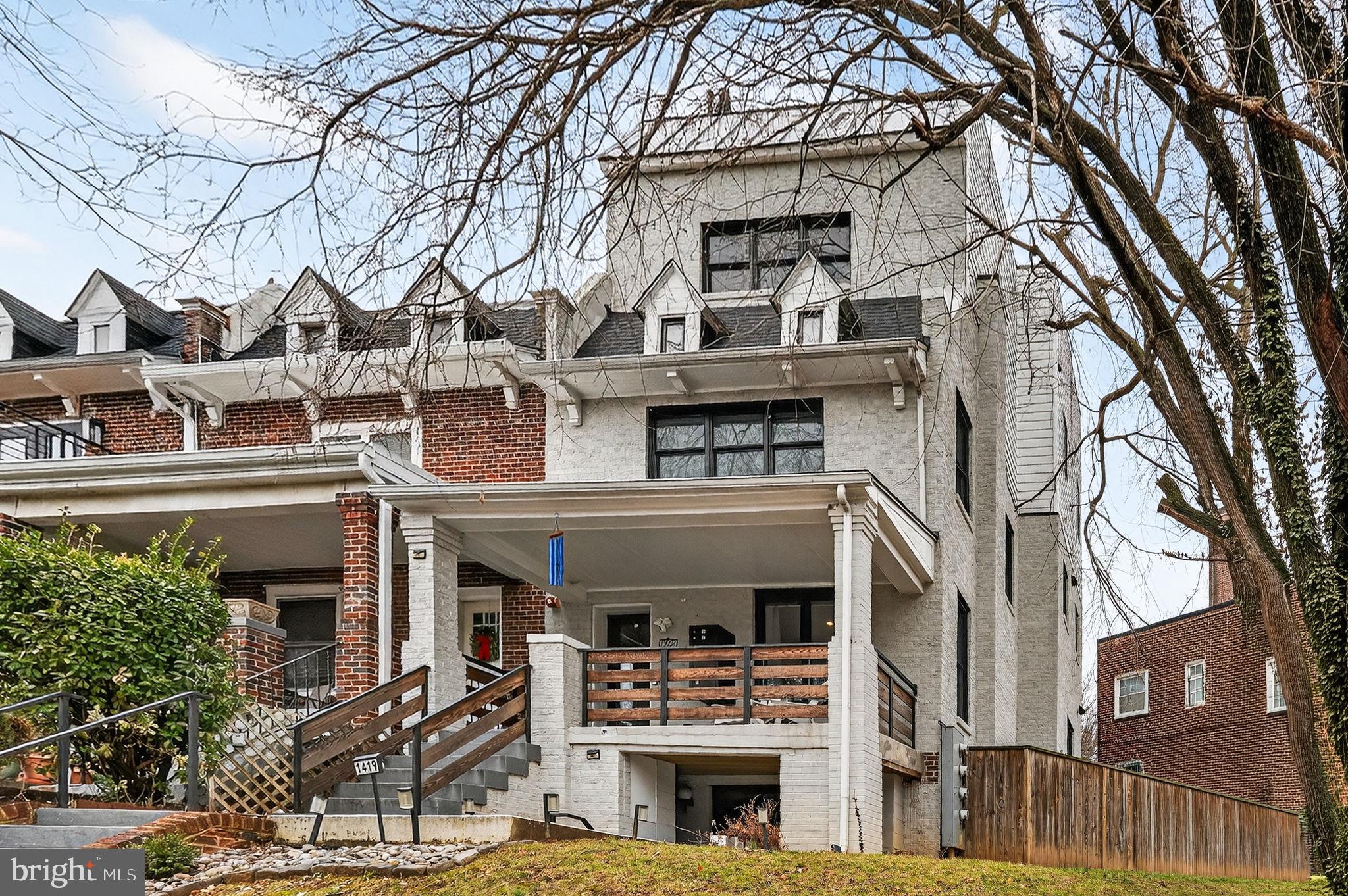 1419 Upshur Street Northwest, Unit 2 Washington, DC 20011 - Photo 2 of 47 a front view of a building with large trees