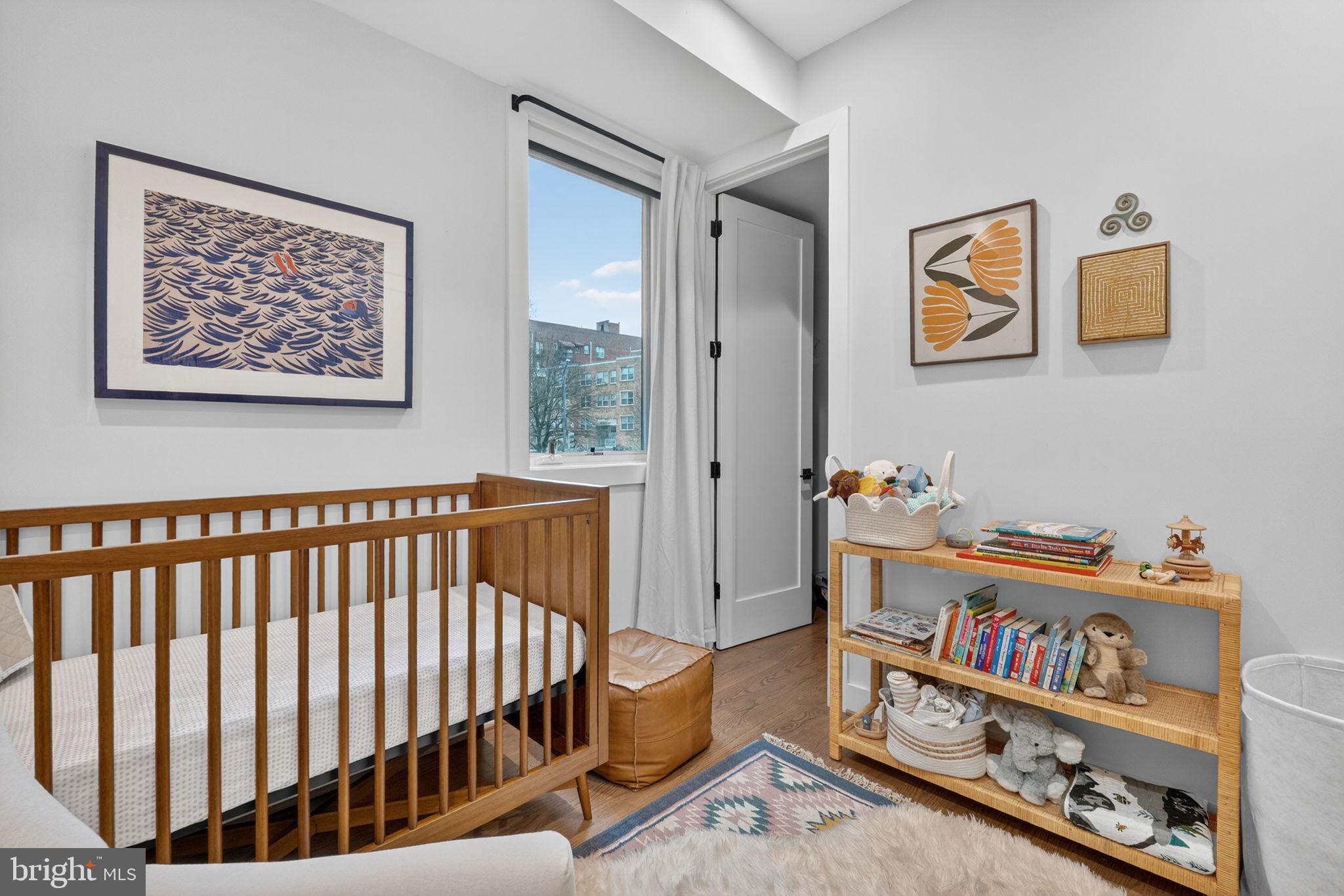 1419 Upshur Street Northwest, Unit 2 Washington, DC 20011 - Photo 22 of 47 a bedroom with furniture a rug and a window