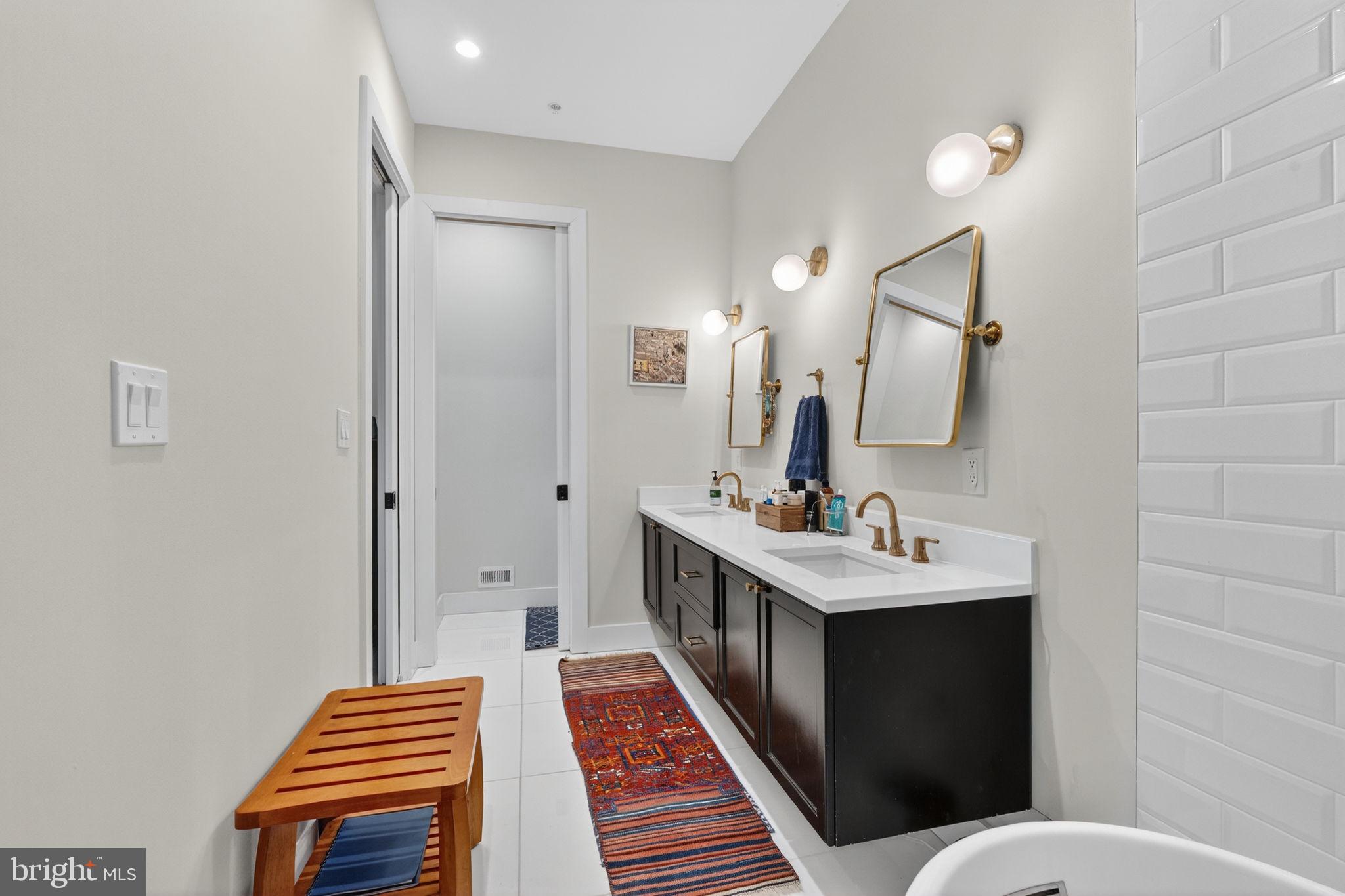 1419 Upshur Street Northwest, Unit 2 Washington, DC 20011 - Photo 29 of 47 a bathroom with a sink and a mirror