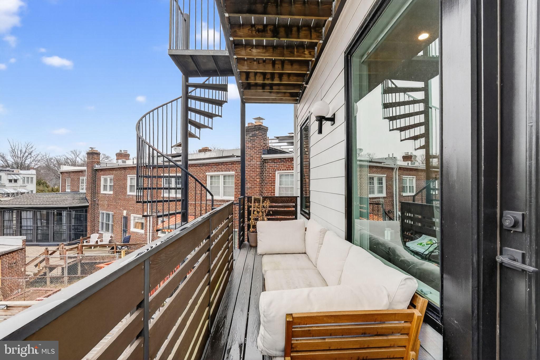1419 Upshur Street Northwest, Unit 2 Washington, DC 20011 - Photo 32 of 47 a view of balcony with two chairs and a table