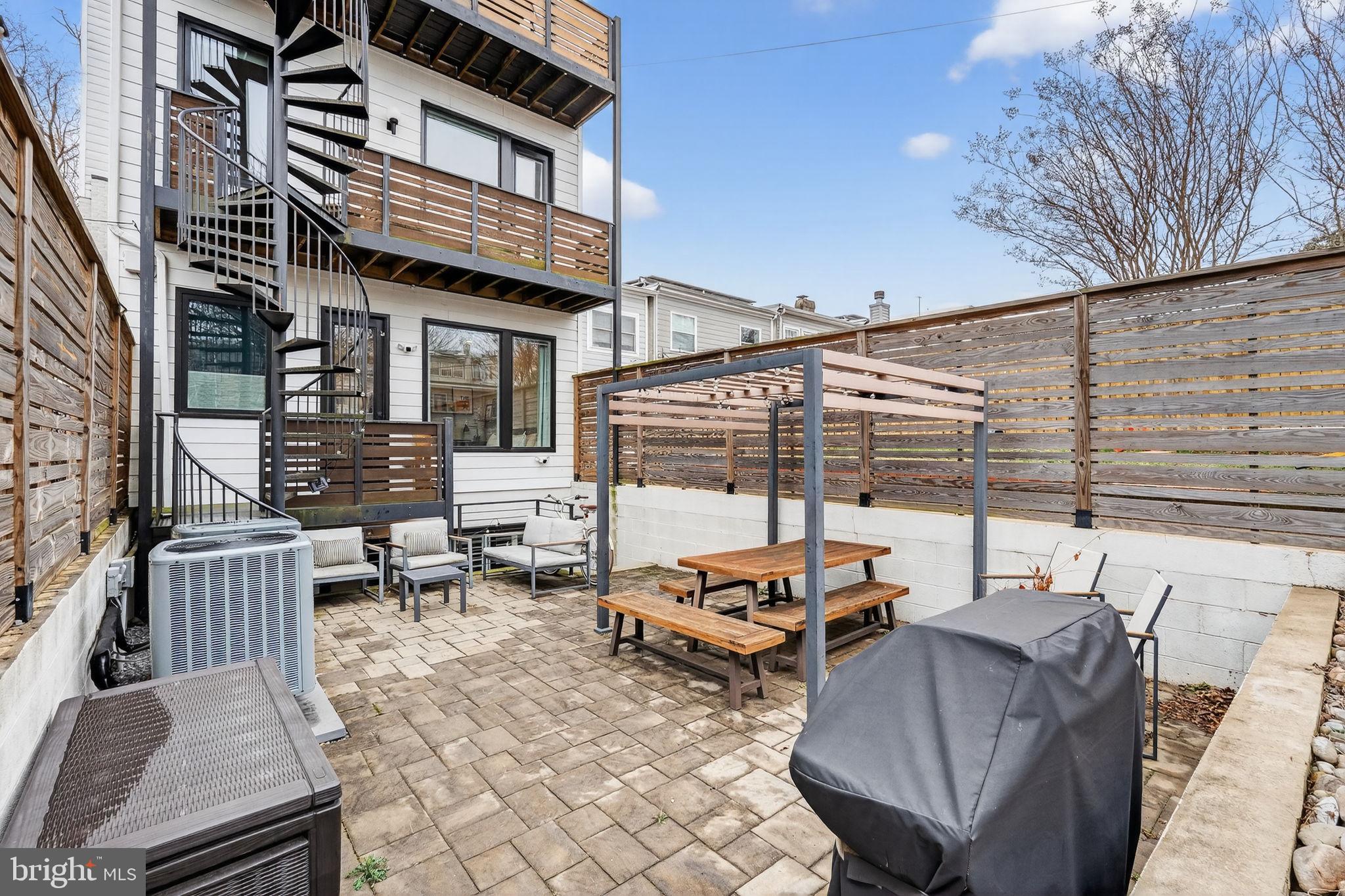 1419 Upshur Street Northwest, Unit 2 Washington, DC 20011 - Photo 34 of 47 a view of a patio with couches chairs and wooden floor