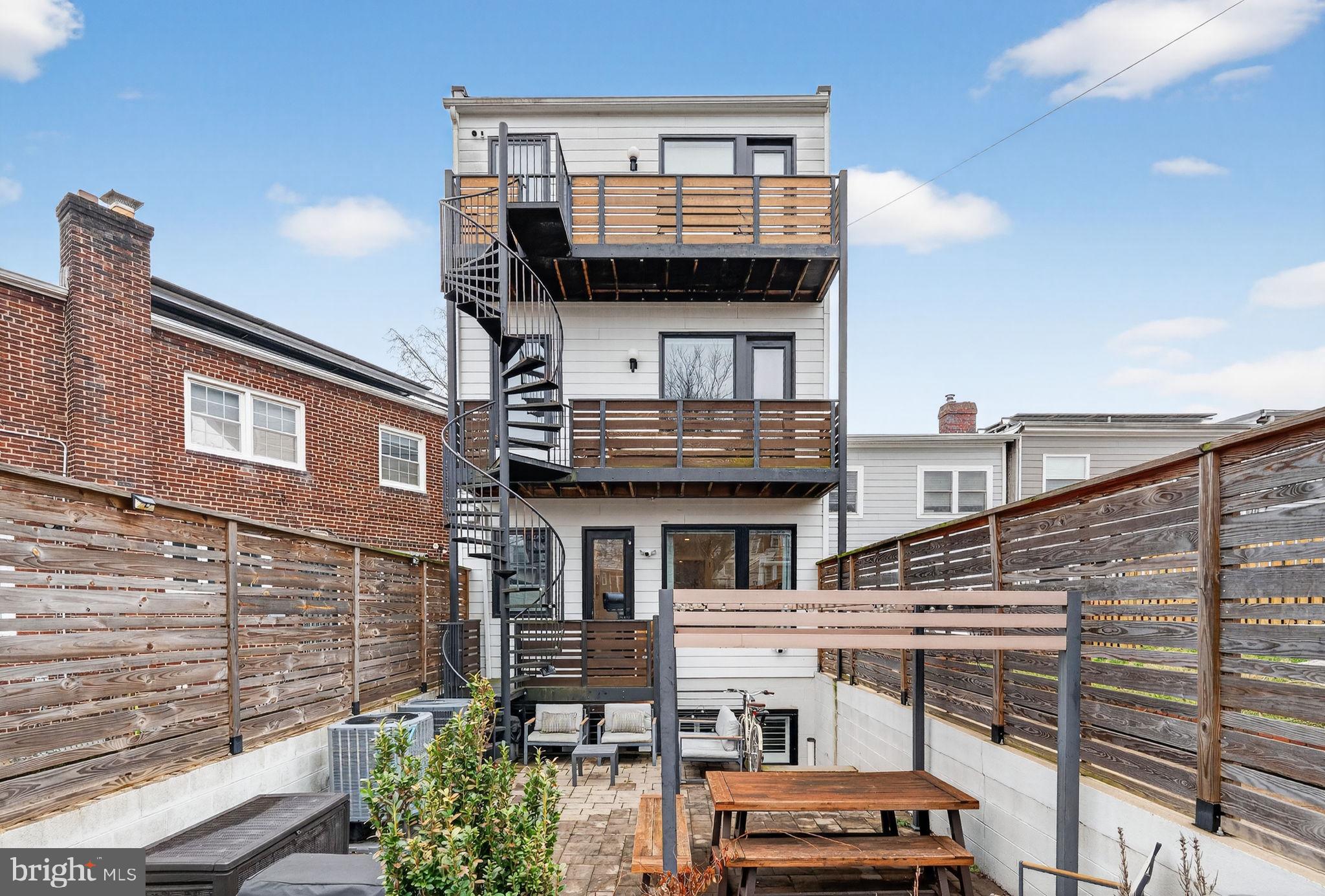 1419 Upshur Street Northwest, Unit 2 Washington, DC 20011 - Photo 35 of 47 a view of a house with a balcony and stairs