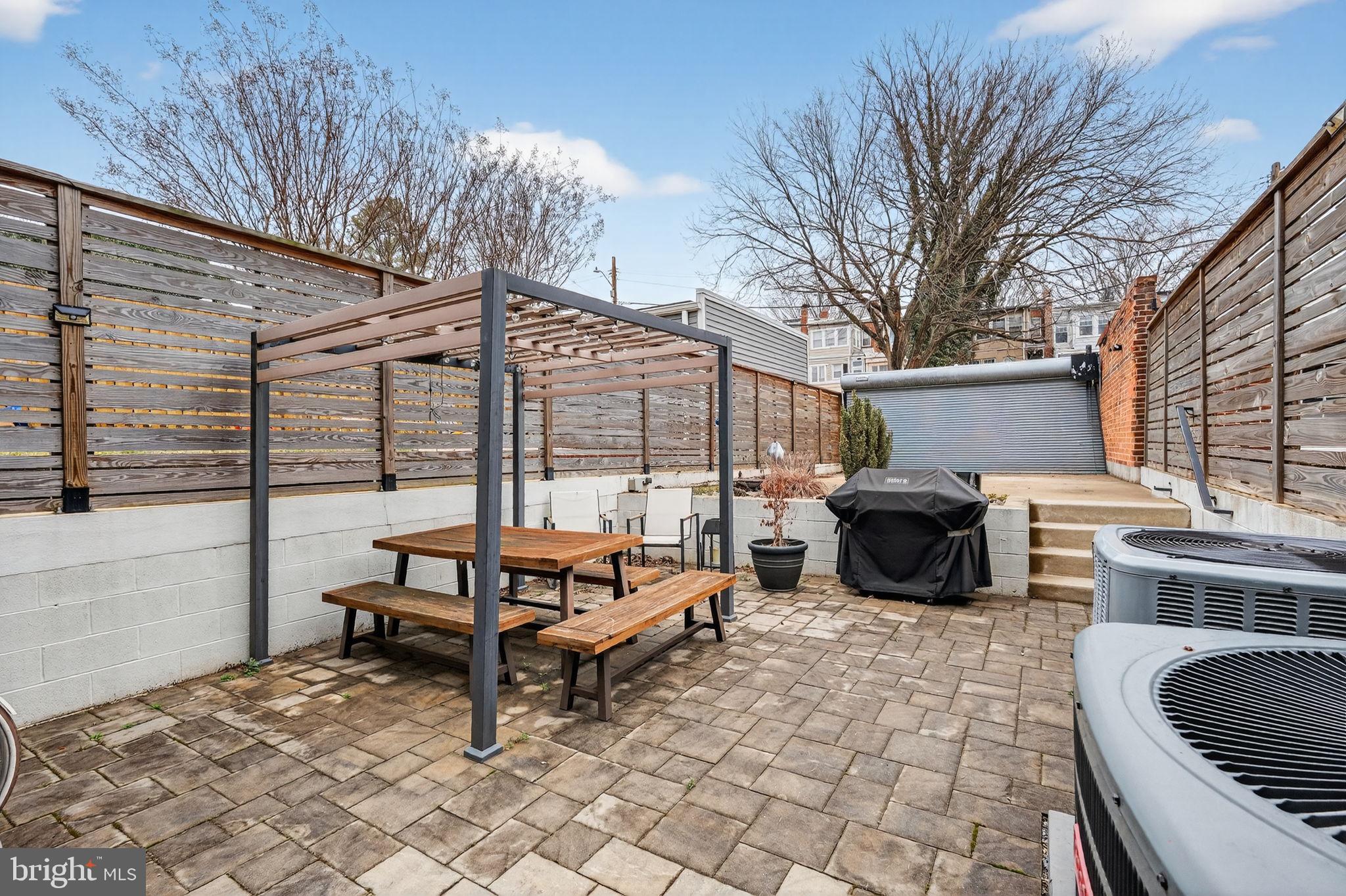 1419 Upshur Street Northwest, Unit 2 Washington, DC 20011 - Photo 38 of 47 a building outdoor space with patio furniture and barbeque oven