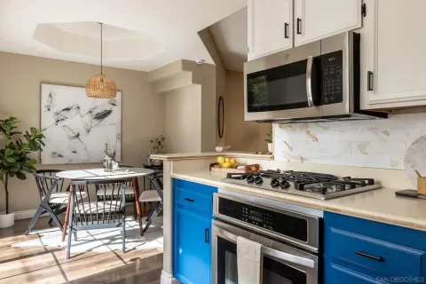 a kitchen that has a stove and a microwave