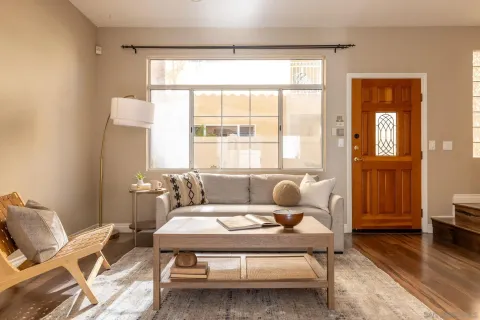 a living room with furniture and a window