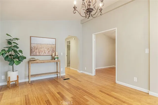 a view of a room with wooden floor and window