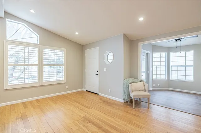 a view of a livingroom with a lounge chair and a window