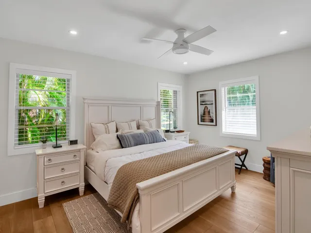 a bed room with a bed and a window