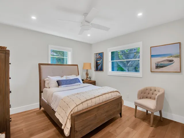 a bedroom with bed and a window