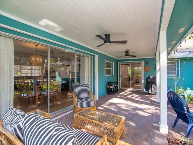 a view of a patio with a table and chairs