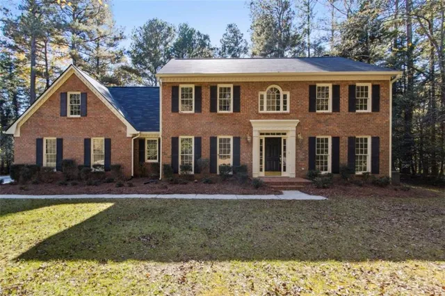 a view of a yard with trees