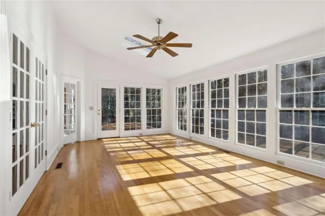 a kitchen with stainless steel appliances granite countertop a sink and a stove