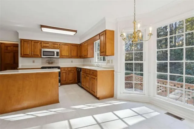 a spacious bathroom with a double vanity sink large mirror and bathtub