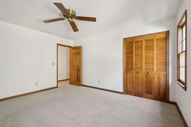 a sign that is sitting in front of flowers