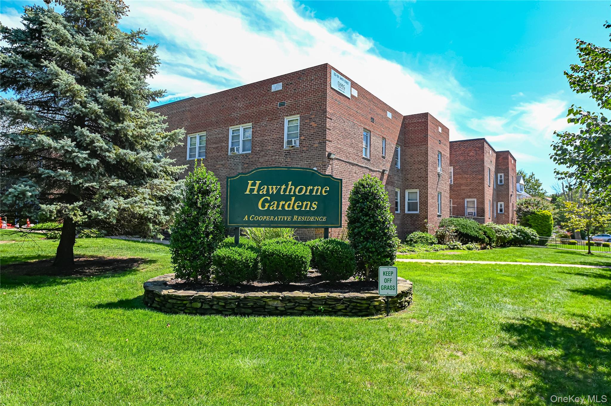 153 Smith Street, Unit F22 Freeport, NY 11520 - Photo 1 of 1 a view of a building with a yard