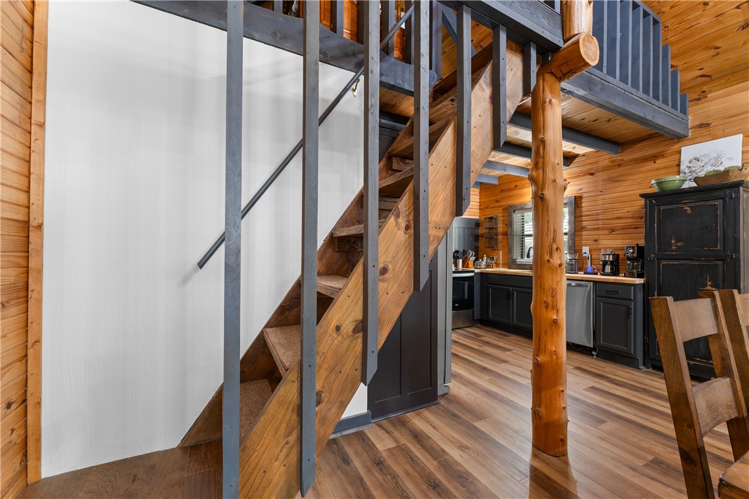 3931 Zack Road Marshall, AR 72650 - Photo 50 of 56 Staircase featuring wood walls and wood finished floors
