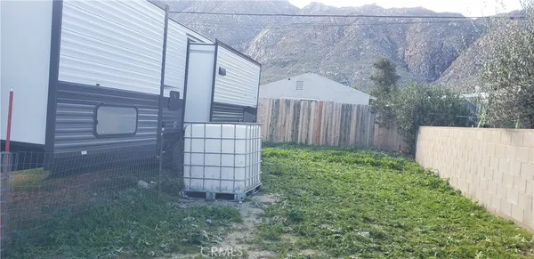 a view of a back yard of the house