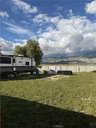 a view of a large pool with a yard