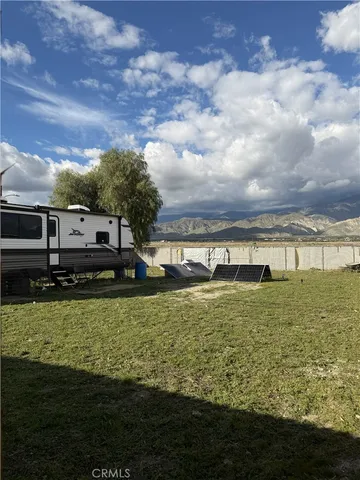 a view of a large pool with a yard