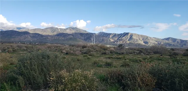 a view of a city with mountains in the background