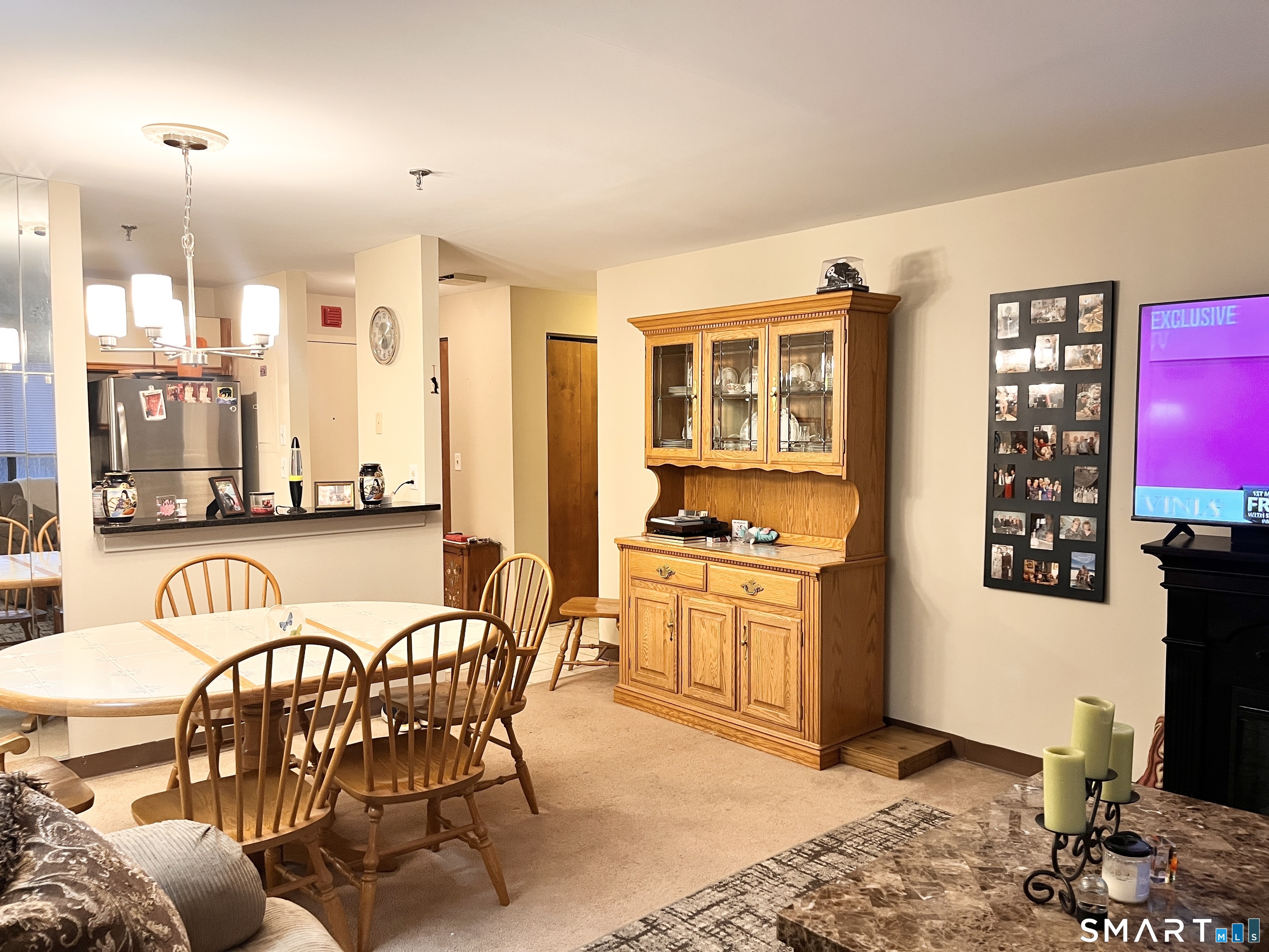 96 Putter Drive, Unit 510N Wallingford, CT 06492 - Photo 12 of 23 a dining room with furniture and a floor to ceiling window