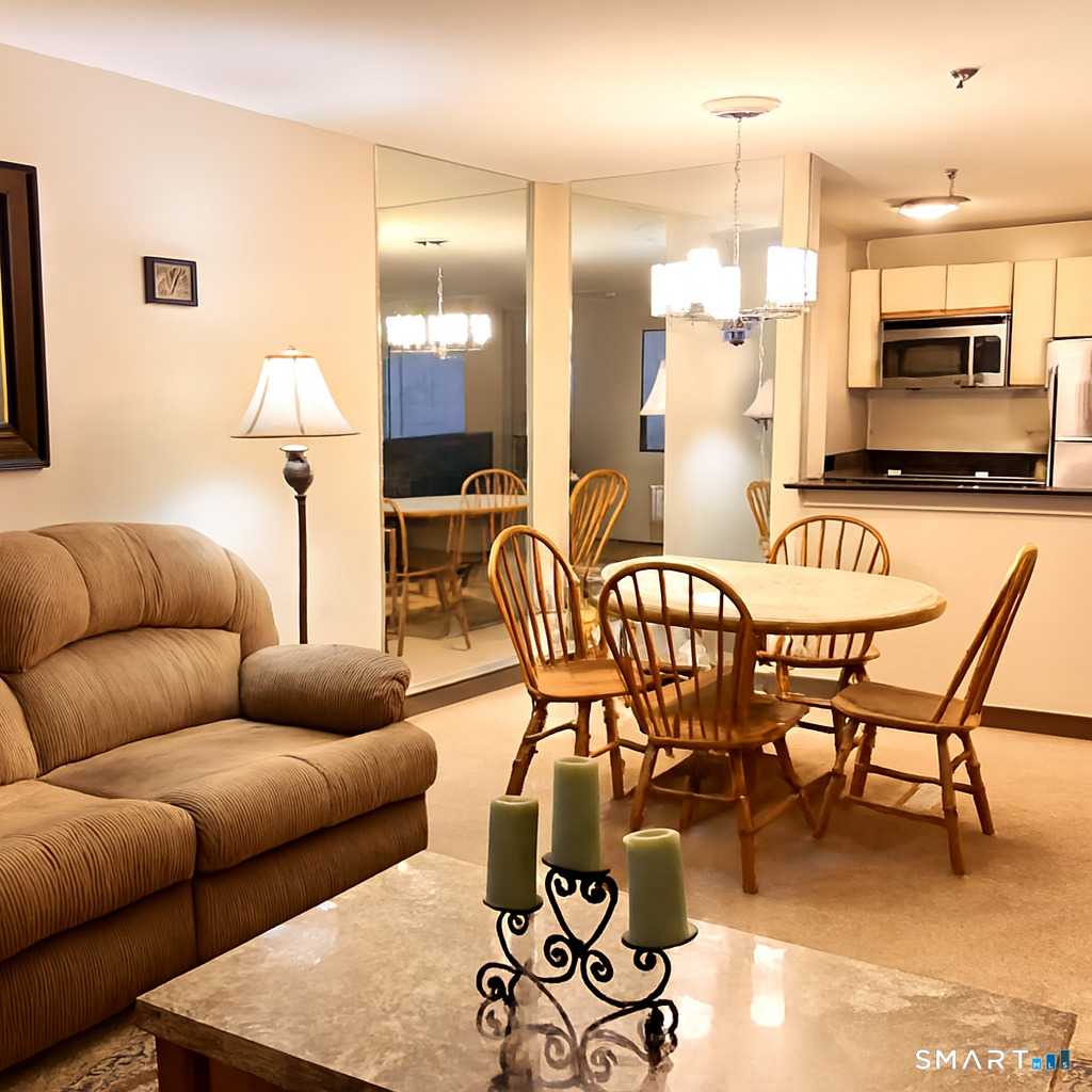 96 Putter Drive, Unit 510N Wallingford, CT 06492 - Photo 14 of 23 a living room with furniture kitchen view and a chandelier