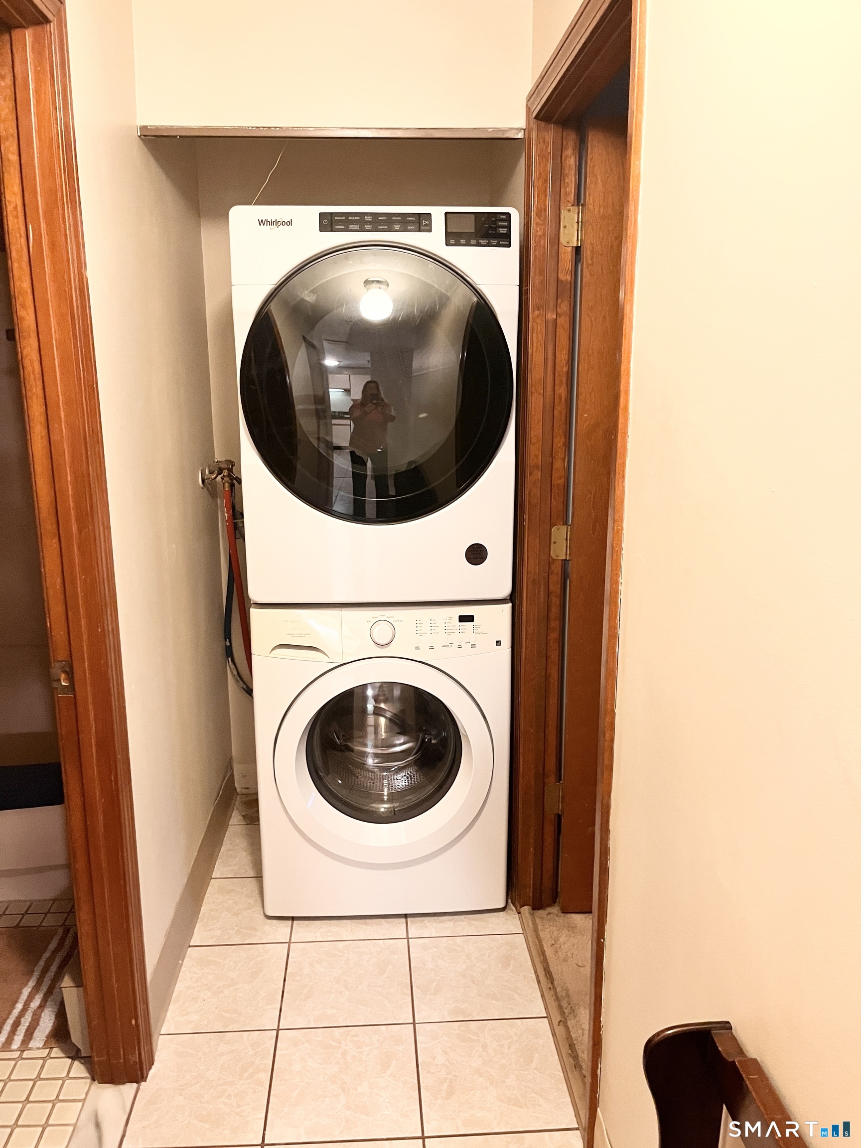 96 Putter Drive, Unit 510N Wallingford, CT 06492 - Photo 15 of 23 a view of a hallway with washer and dryer
