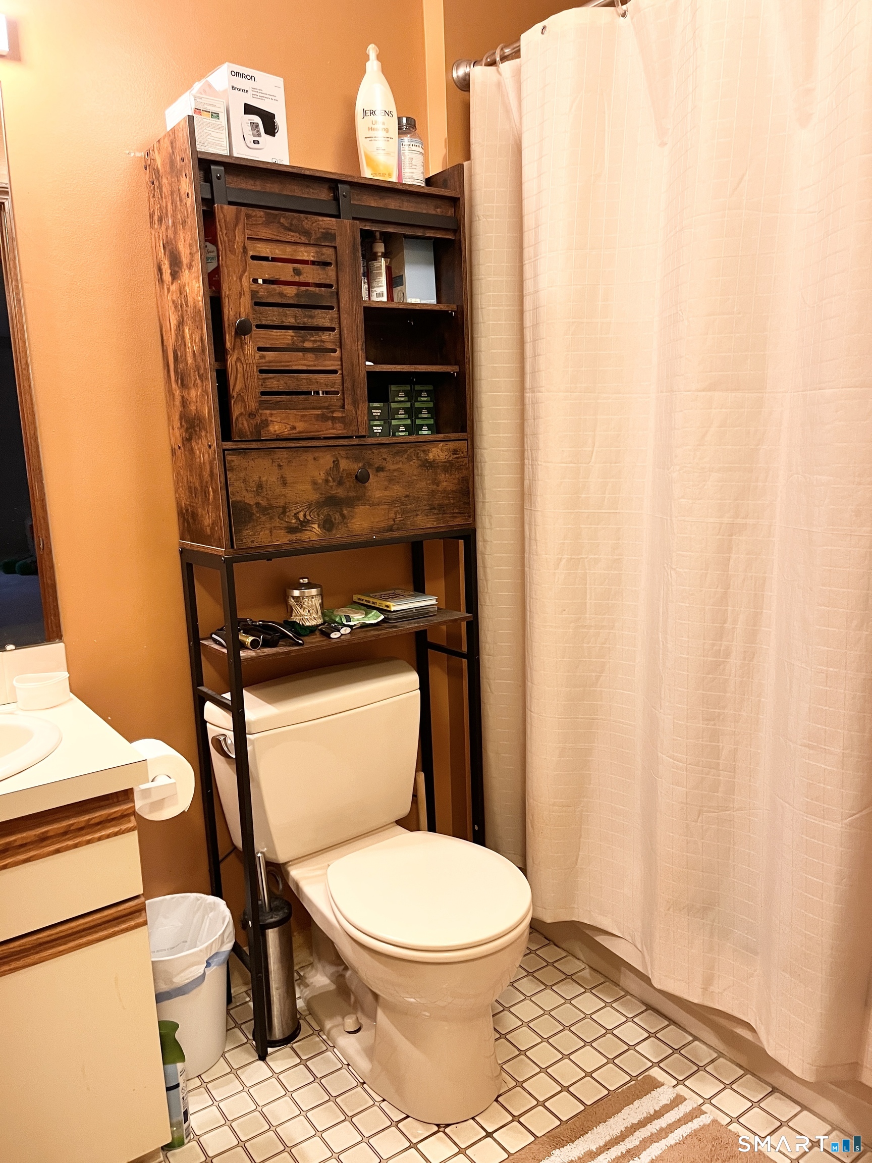 96 Putter Drive, Unit 510N Wallingford, CT 06492 - Photo 16 of 23 a bathroom with a toilet and a shower curtain