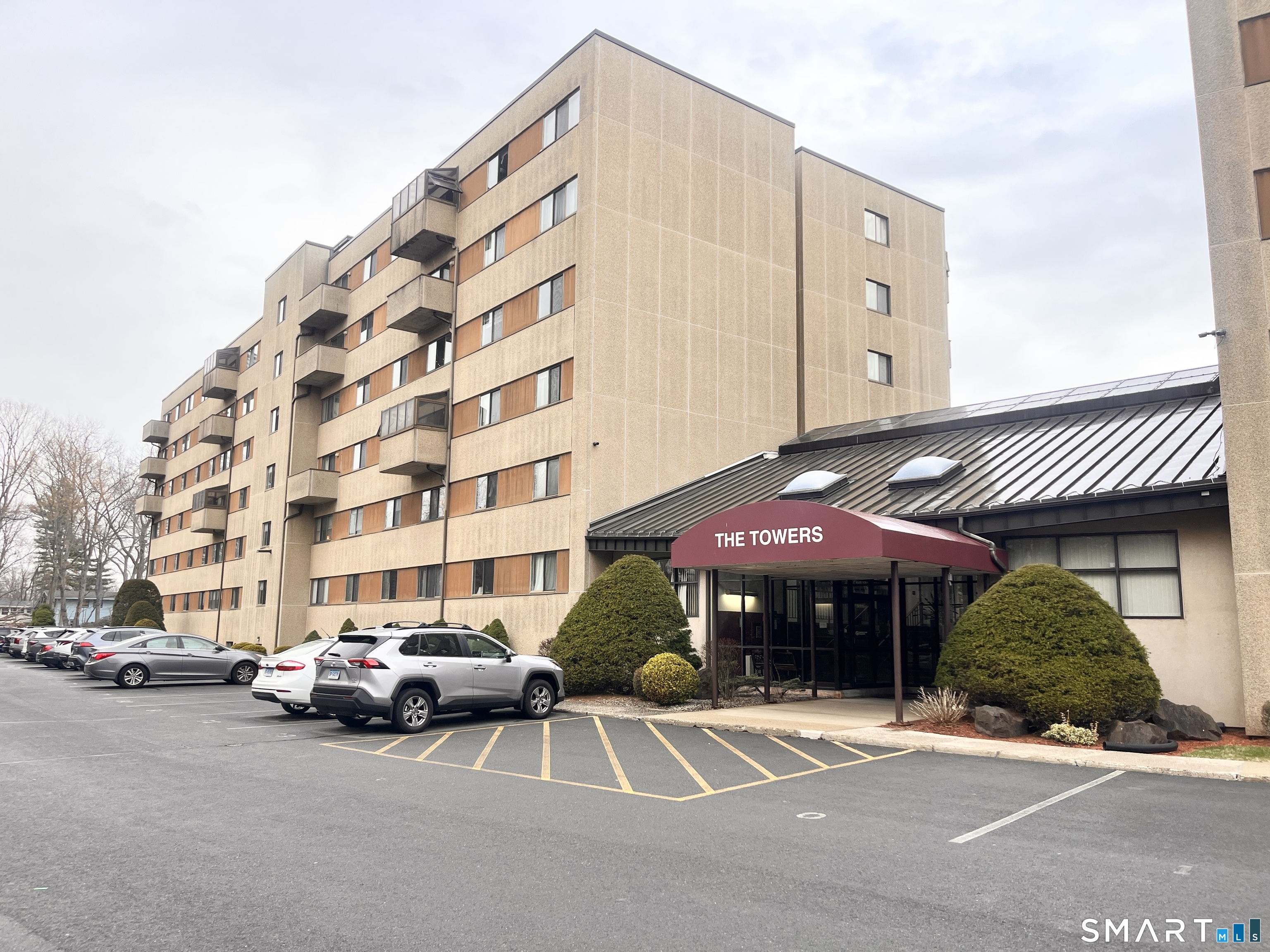 96 Putter Drive, Unit 510N Wallingford, CT 06492 - Photo 2 of 23 a car parked in front of a building