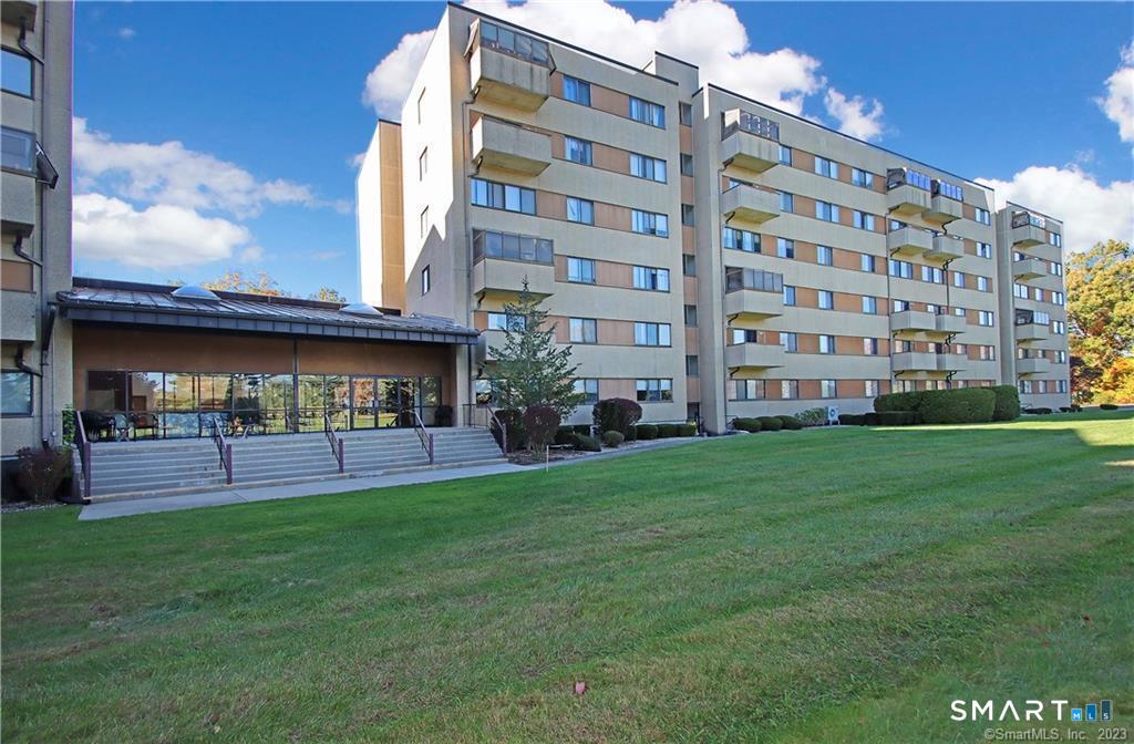 96 Putter Drive, Unit 510N Wallingford, CT 06492 - Photo 23 of 23 a view of a building with a yard