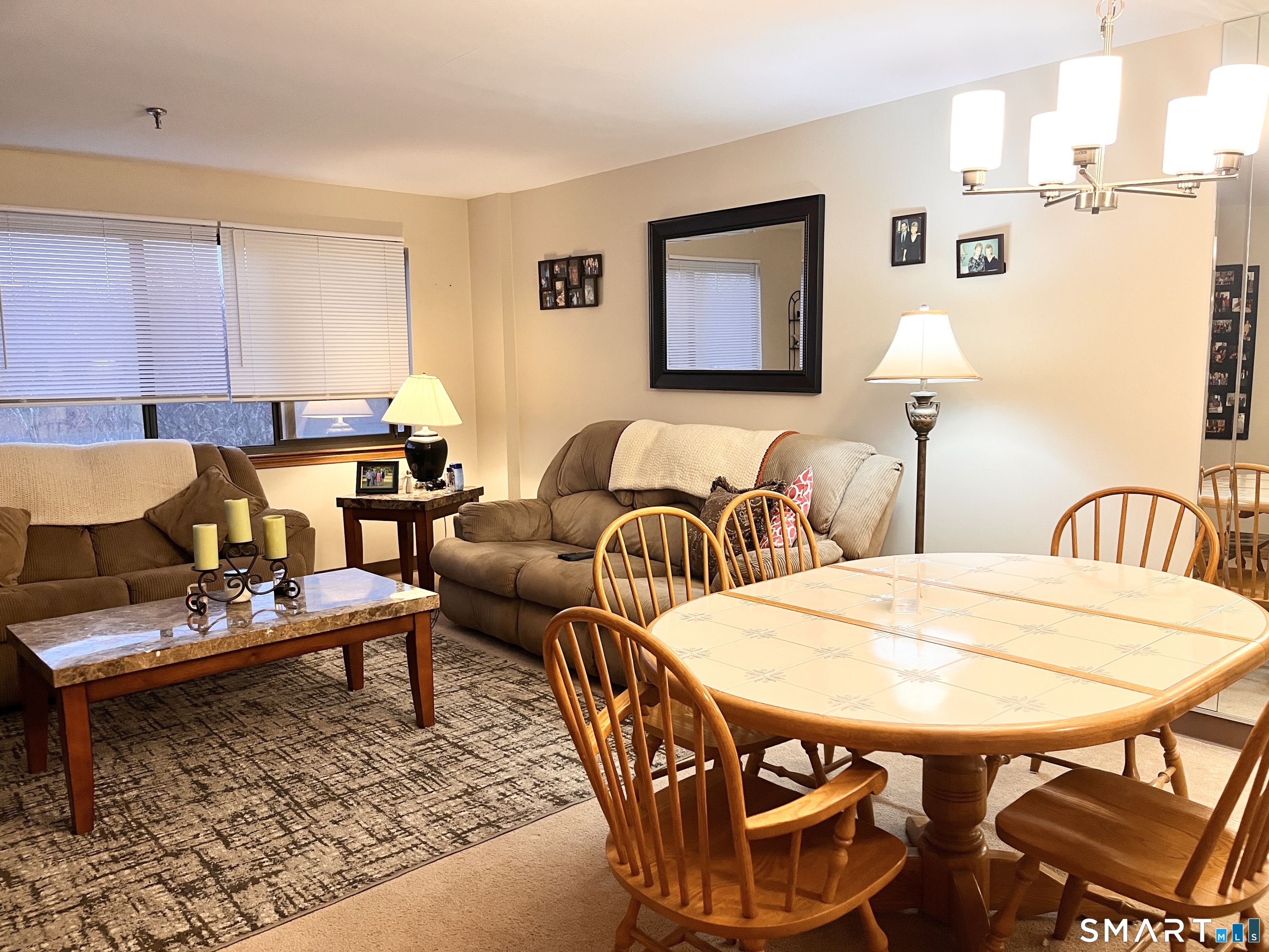 96 Putter Drive, Unit 510N Wallingford, CT 06492 - Photo 8 of 23 a living room with furniture a rug and a table
