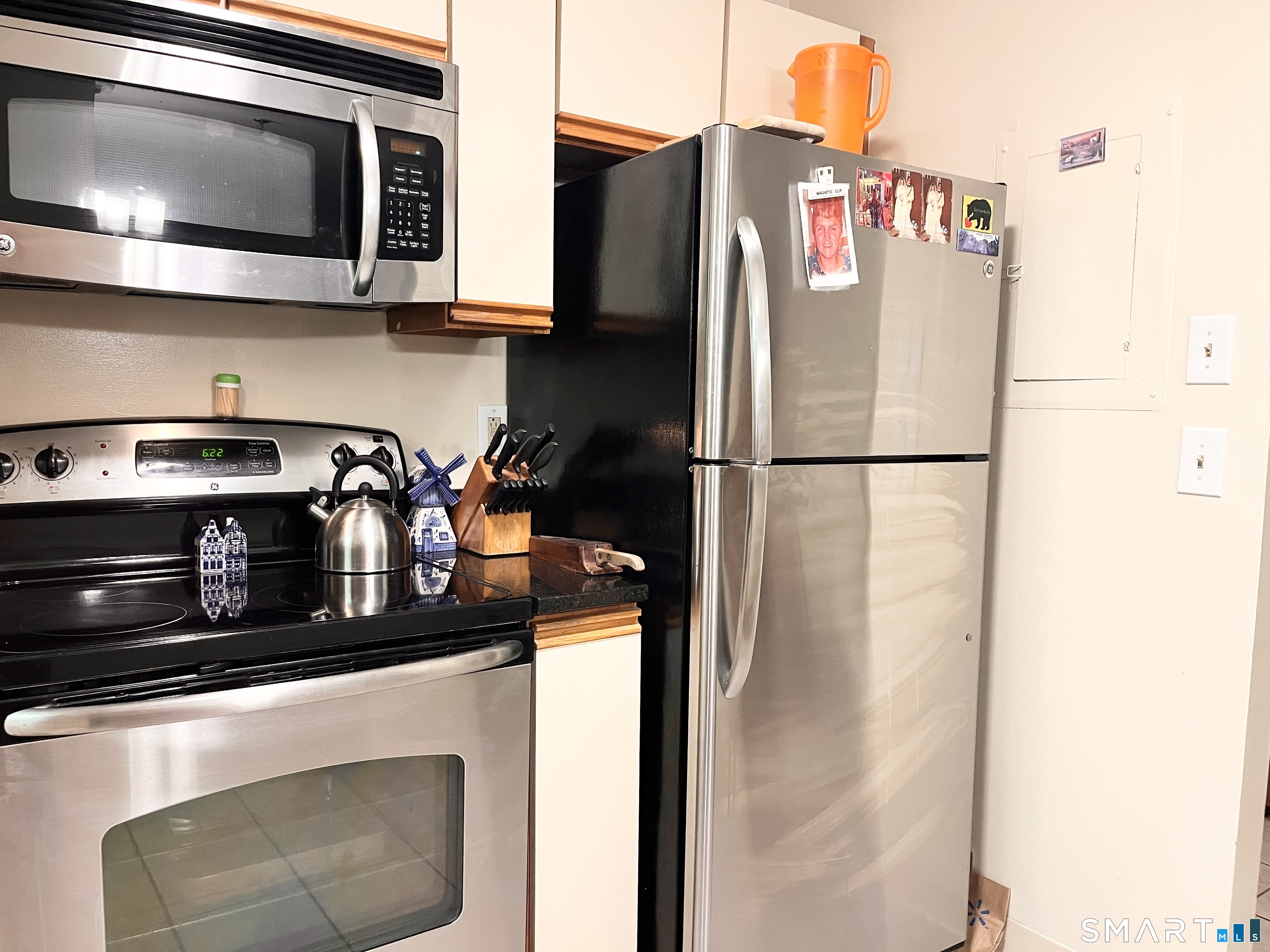 96 Putter Drive, Unit 510N Wallingford, CT 06492 - Photo 10 of 23 a white refrigerator freezer sitting inside of a kitchen