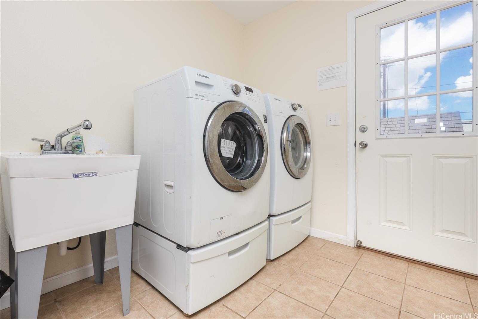 99-036 Moanalua Road, Unit A1 Aiea, HI 96701 - Photo 14 of 18 a utility room with dryer and washer