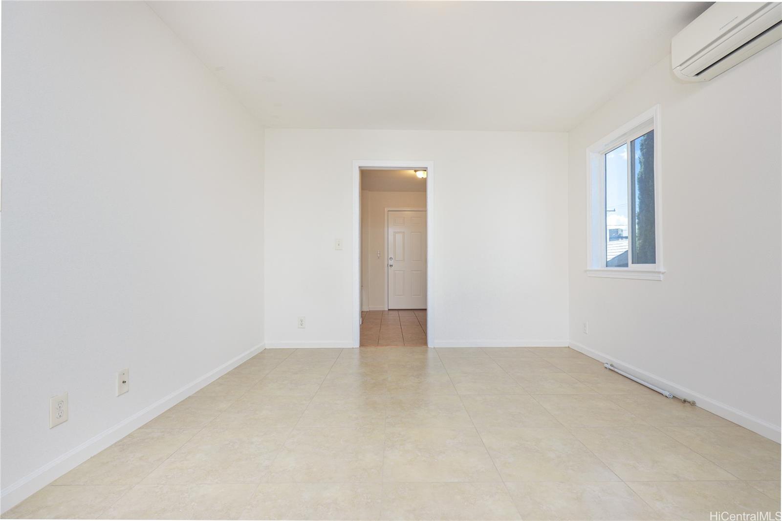 99-036 Moanalua Road, Unit A1 Aiea, HI 96701 - Photo 15 of 18 an empty room with a window