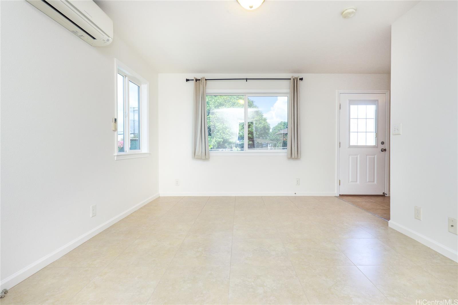 99-036 Moanalua Road, Unit A1 Aiea, HI 96701 - Photo 17 of 18 an empty room with windows