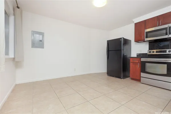 a kitchen with stainless steel appliances a refrigerator and a stove top oven