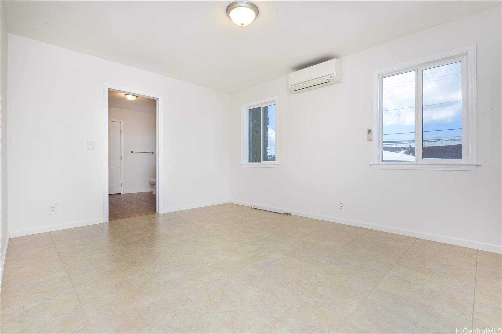 99-036 Moanalua Road, Unit A1 Aiea, HI 96701 - Photo 6 of 18 an empty room with windows and closet
