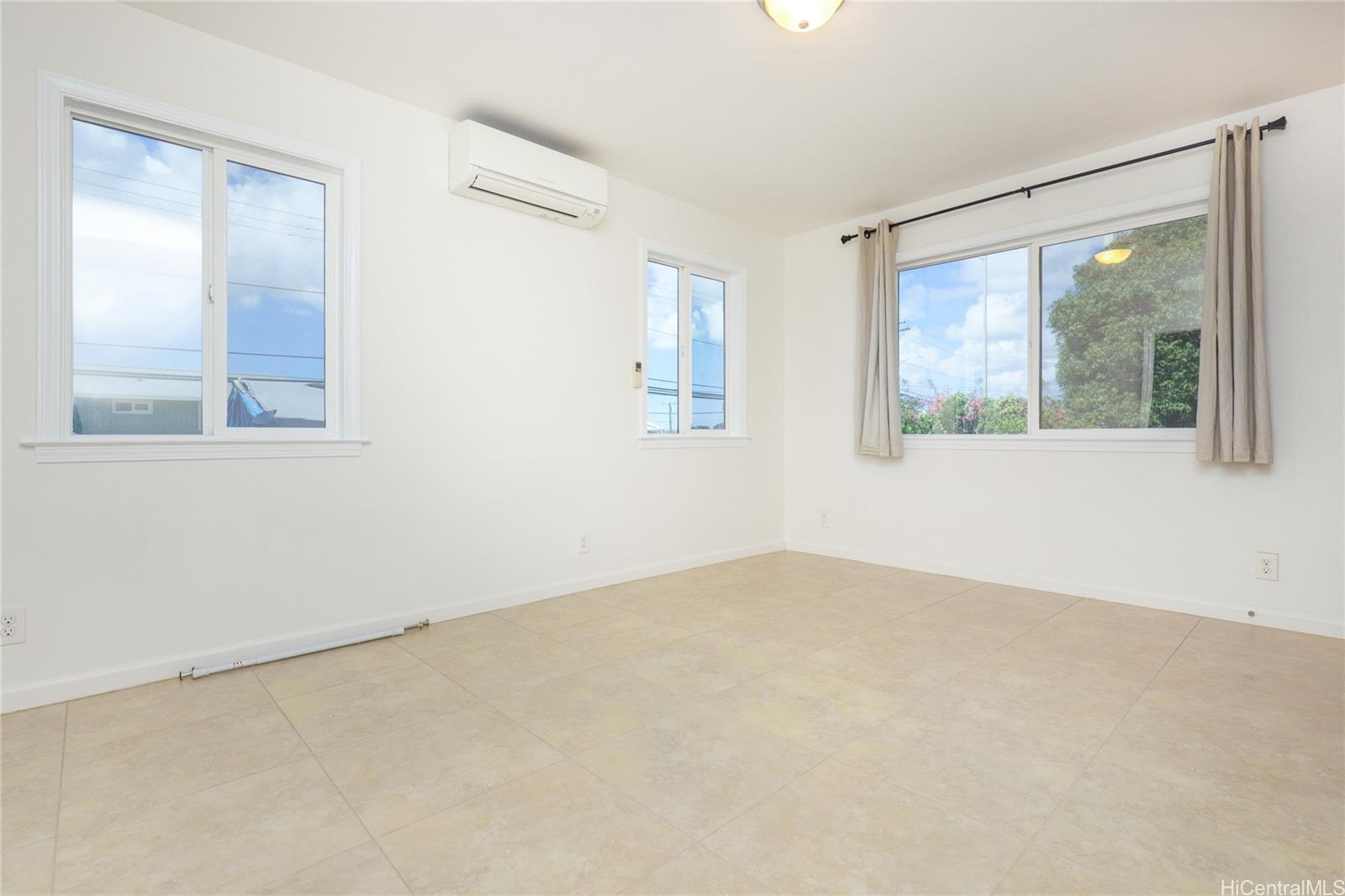99-036 Moanalua Road, Unit A1 Aiea, HI 96701 - Photo 7 of 18 an empty room with a window