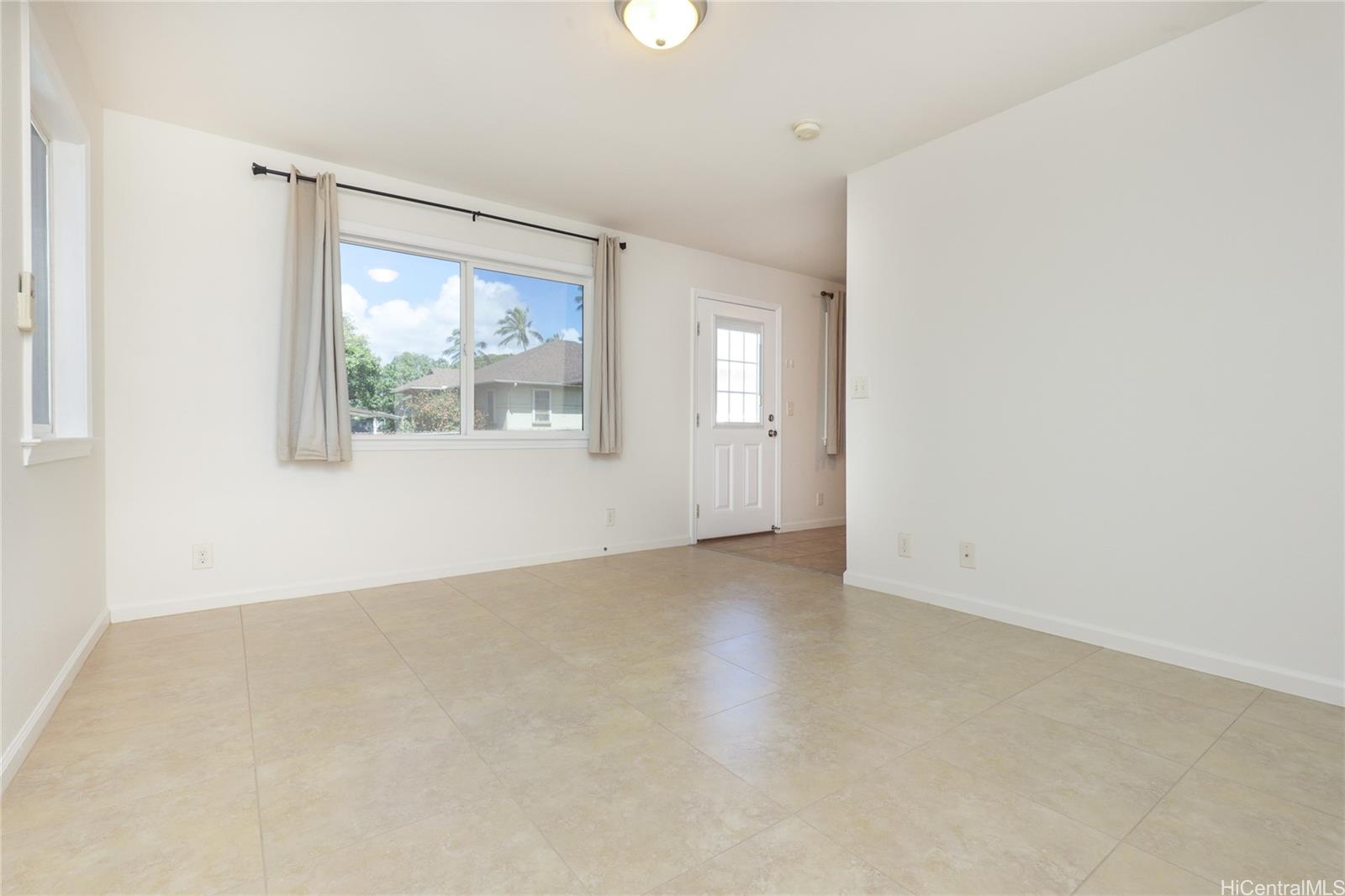 99-036 Moanalua Road, Unit A1 Aiea, HI 96701 - Photo 8 of 18 an empty room with windows and closet