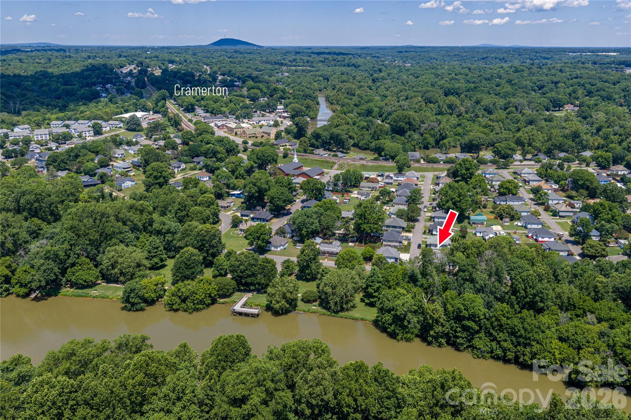 58 Fourth Street Cramerton, NC 28032 - Photo 15 of 44 a view of a lush green forest with a house