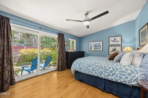 a bedroom with a large bed and a large window