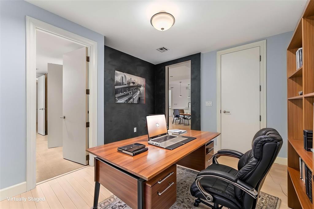 1505 Elm Street, Unit 1003 Dallas, TX 75201 - Photo 14 of 20 a workspace with furniture and bathroom