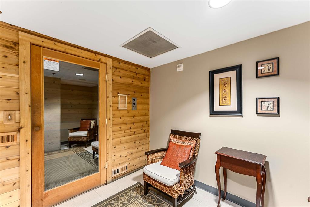 1505 Elm Street, Unit 1003 Dallas, TX 75201 - Photo 20 of 20 a bedroom with a bed and wooden floor