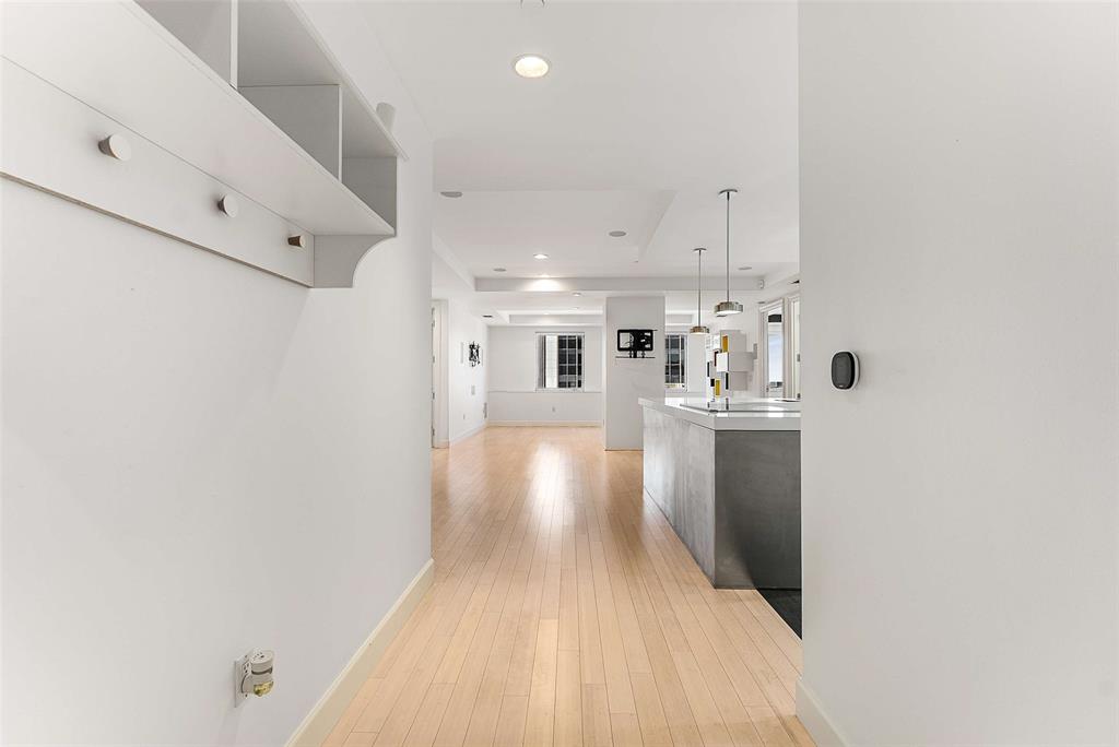 1505 Elm Street, Unit 1003 Dallas, TX 75201 - Photo 2 of 33 a view of kitchen with furniture and wooden floor