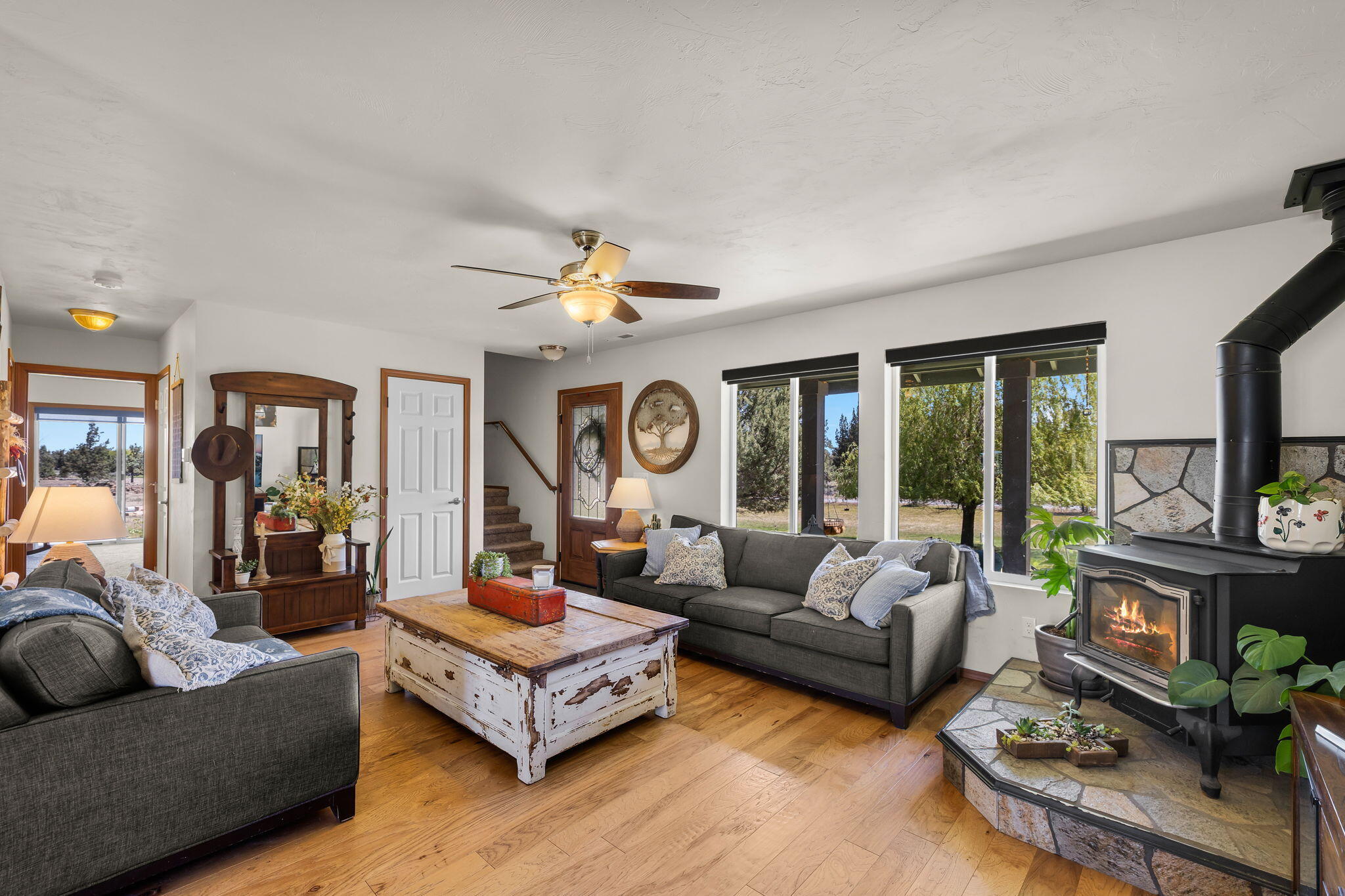 63639 Gentry Loop Bend, OR 97701 - Photo 10 of 40 a living room with furniture and a fireplace