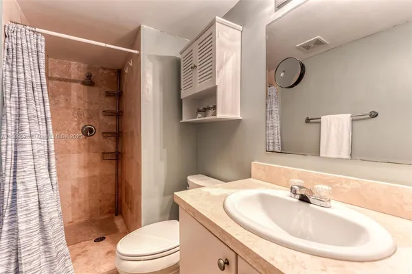 a street sign sitting on top of a wall