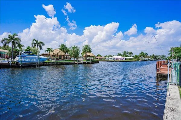 a view of a lake with outside a house