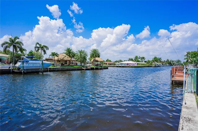 a view of a lake with outside a house